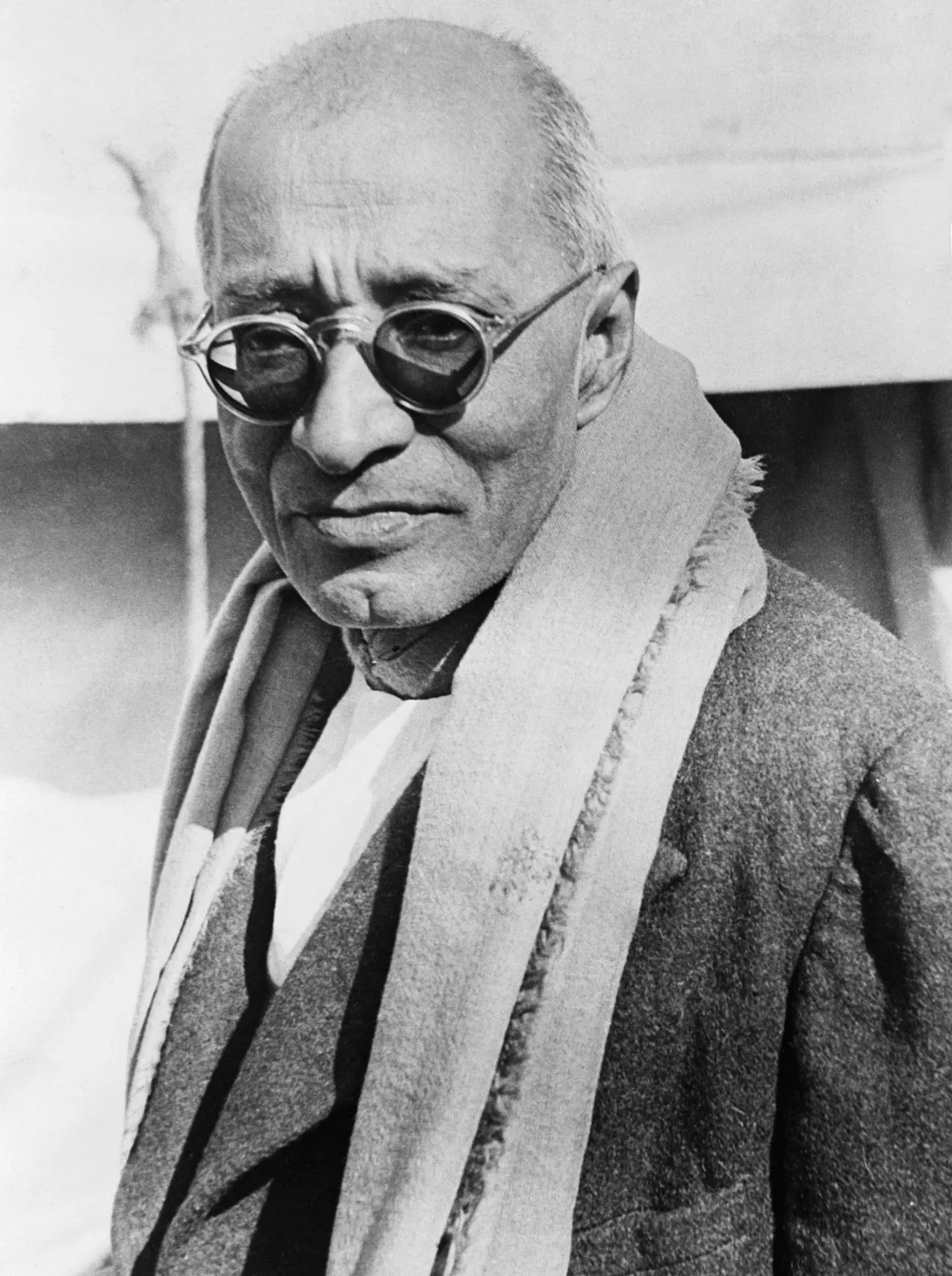 C. Rajagopalachari in 1948 wearing dark glasses, a coat and a heavy shawl.
